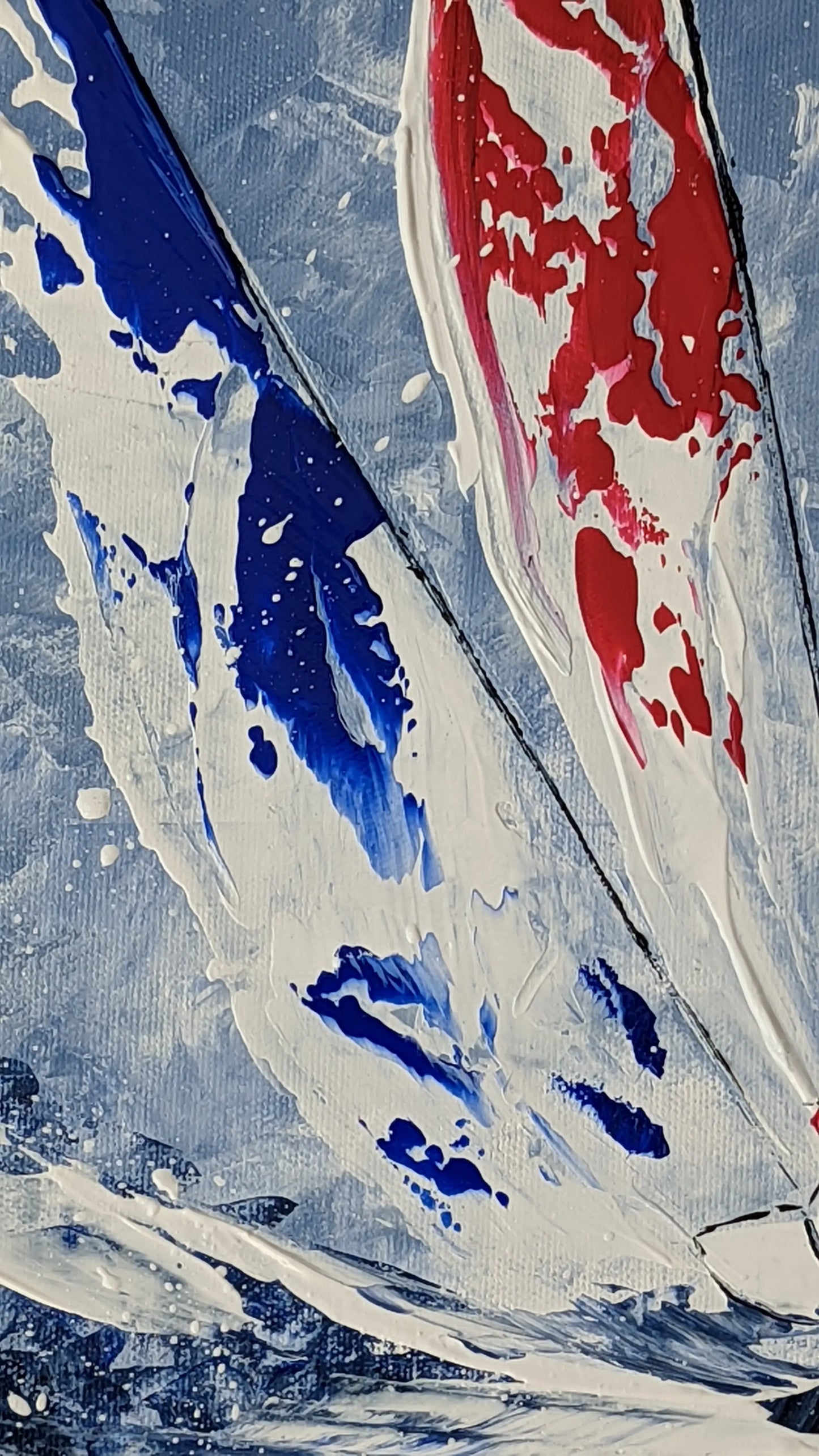 Les voiliers-zoom-sur-voile-bleue-et-rouge